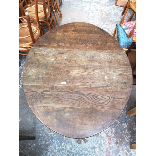 98 - A 19th century oak drop leaf gate leg oval dining table - approx. 72cm high x 103cm wide x 124cm lon... 