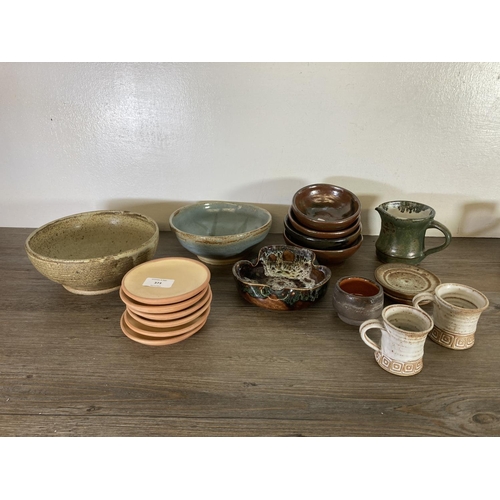 373 - A large collection of studio pottery to include Ayrton Looe blue drip glazed jug, mugs and bowl etc.