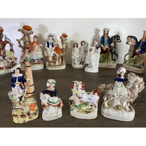 376 - A collection of Staffordshire pottery flatback figurines