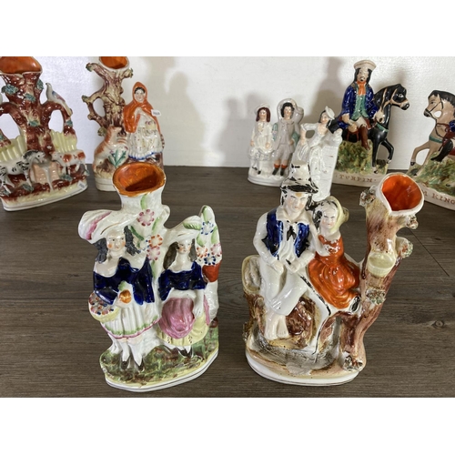 376 - A collection of Staffordshire pottery flatback figurines