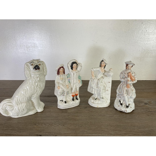 376 - A collection of Staffordshire pottery flatback figurines