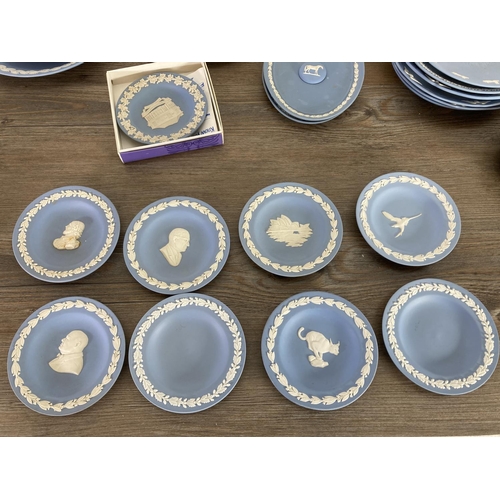 333 - A collection of Wedgwood pale blue Jasperware to include trinket dishes, plates etc.