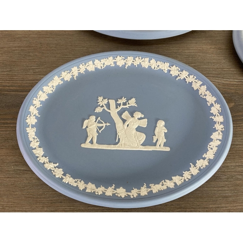 334 - Six pieces of Wedgwood pale blue Jasperware, four plaques, one 20cm bowl and one 15cm bowl