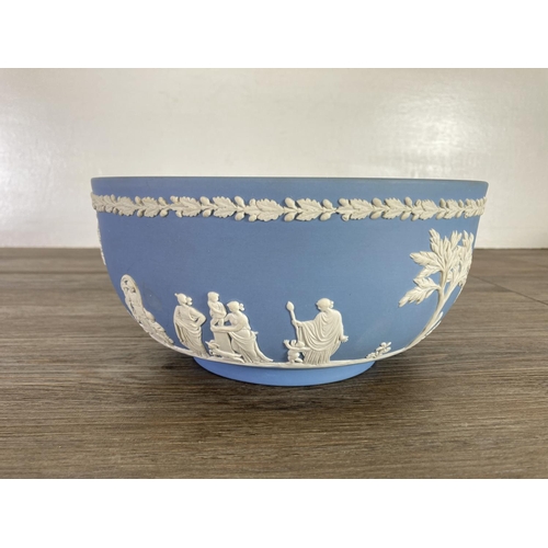 334 - Six pieces of Wedgwood pale blue Jasperware, four plaques, one 20cm bowl and one 15cm bowl