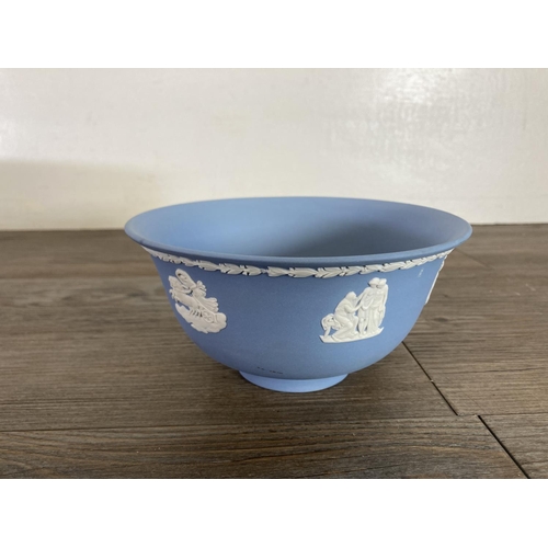 334 - Six pieces of Wedgwood pale blue Jasperware, four plaques, one 20cm bowl and one 15cm bowl