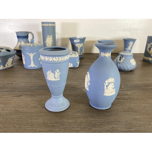 336 - A collection of Wedgwood pale blue Jasperware to include Etruscan jug, vases, trinket boxes etc.