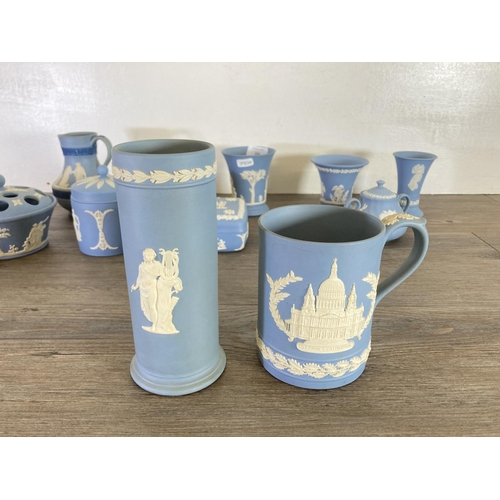 336 - A collection of Wedgwood pale blue Jasperware to include Etruscan jug, vases, trinket boxes etc.