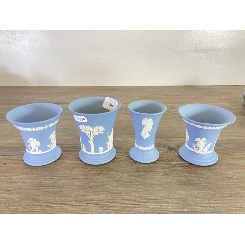 336 - A collection of Wedgwood pale blue Jasperware to include Etruscan jug, vases, trinket boxes etc.