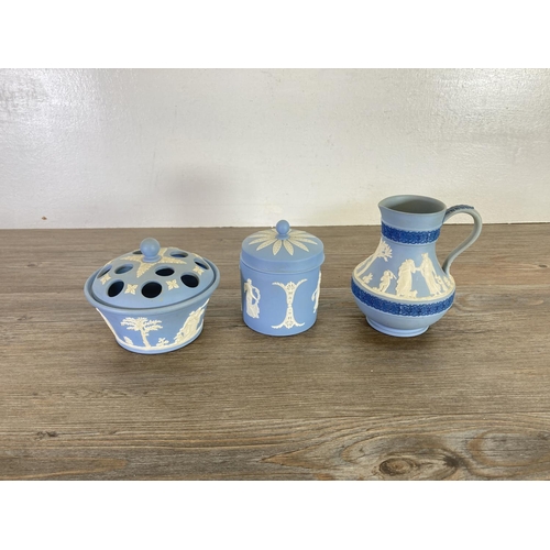 336 - A collection of Wedgwood pale blue Jasperware to include Etruscan jug, vases, trinket boxes etc.