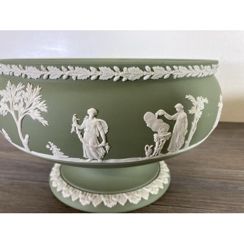 338 - Two Wedgwood sage green Jasperware bowls - largest approx. 13cm high x 20cm diameter