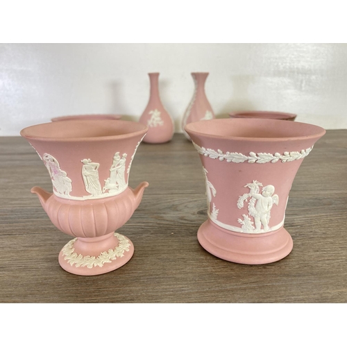 341 - Nine pieces of Wedgwood pink Jasperware to include 23cm plate, 9cm urn vase, 13cm bud vase etc.