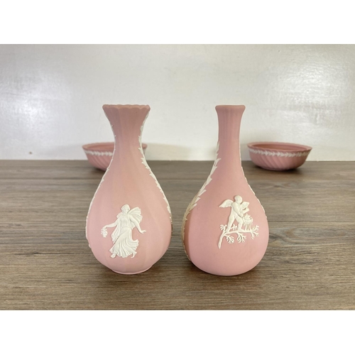 341 - Nine pieces of Wedgwood pink Jasperware to include 23cm plate, 9cm urn vase, 13cm bud vase etc.