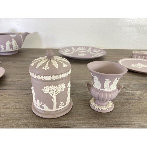 342 - Ten pieces of Wedgwood lilac Jasperware to include 23cm plate, teapot, bell etc.