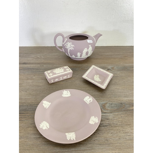 342 - Ten pieces of Wedgwood lilac Jasperware to include 23cm plate, teapot, bell etc.