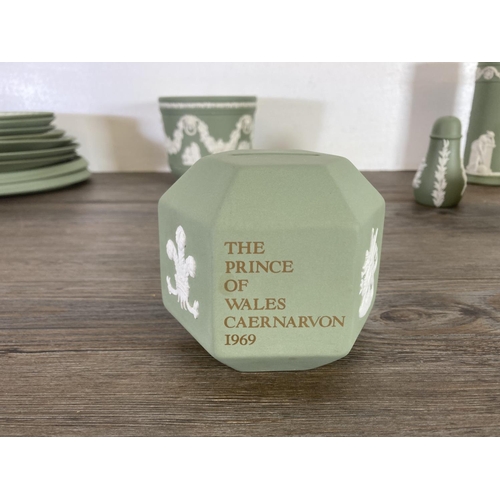 351 - A collection of Wedgwood sage green Jasperware to include The Prince of Wales Caernarvon 1969 money ... 