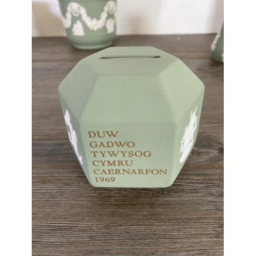 351 - A collection of Wedgwood sage green Jasperware to include The Prince of Wales Caernarvon 1969 money ... 