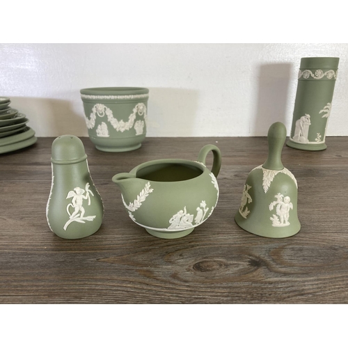 351 - A collection of Wedgwood sage green Jasperware to include The Prince of Wales Caernarvon 1969 money ... 