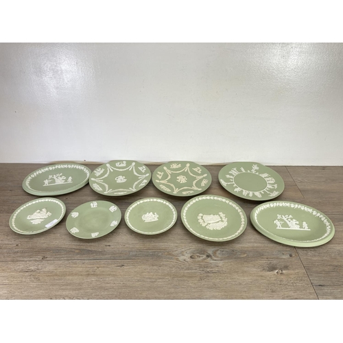 351 - A collection of Wedgwood sage green Jasperware to include The Prince of Wales Caernarvon 1969 money ... 