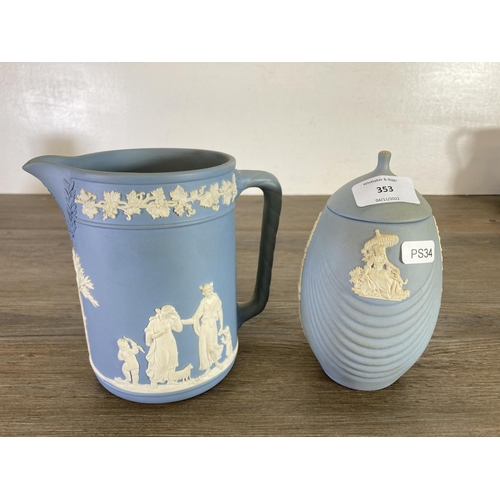 353 - Seven pieces of Wedgwood pale blue Jasperware to include two Etruscan jugs, candlestick etc.