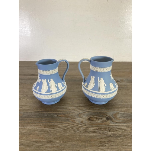 353 - Seven pieces of Wedgwood pale blue Jasperware to include two Etruscan jugs, candlestick etc.