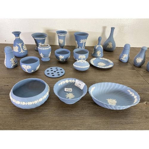 355 - A collection of Wedgwood pale blue Jasperware to include bud vases, salt and pepper shakers etc.