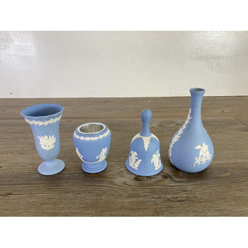 355 - A collection of Wedgwood pale blue Jasperware to include bud vases, salt and pepper shakers etc.