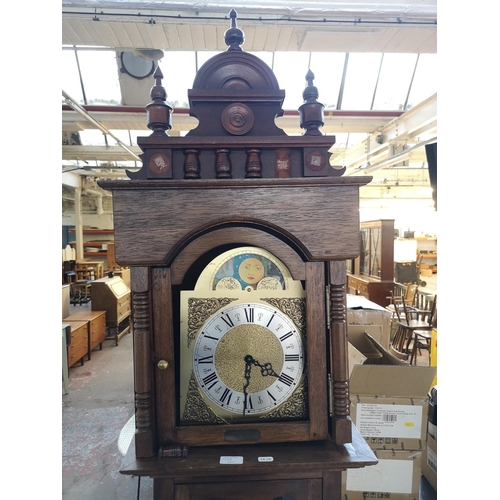 128B - A mahogany grandfather clock with three weights and pendulum - approx. 210cm high x 43cm wide x 24cm... 