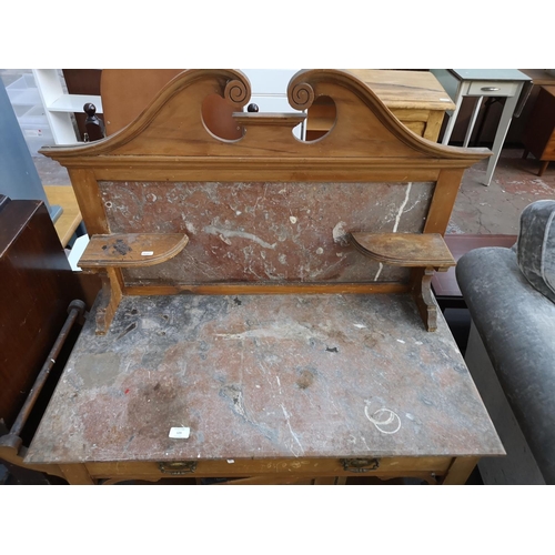 129 - An Edwardian satinwood and marble washstand - approx. 130cm high x 100cm wide x 49cm deep