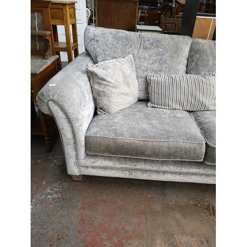 130 - An Alstons Lowry crushed velvet three seater sofa