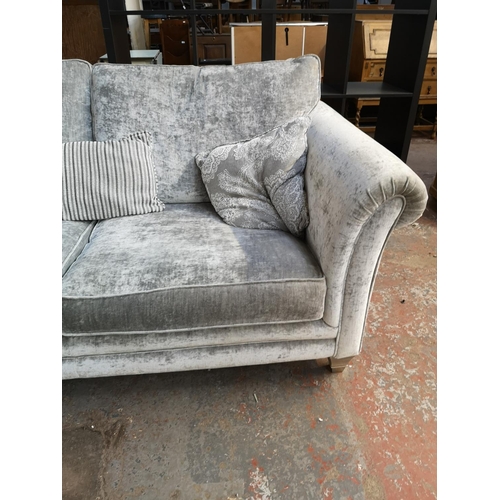 130 - An Alstons Lowry crushed velvet three seater sofa