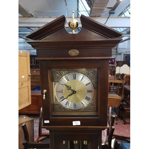 134 - A late 20th century oak cased grandmother clock with weights and pendulum - approx. 188cm high x 36c... 