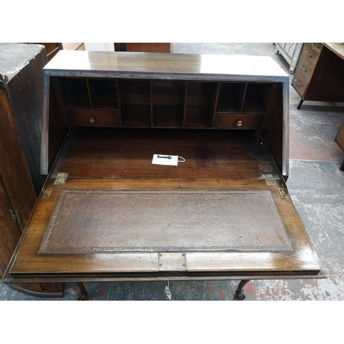 139 - A mid 20th century walnut bureau - approx. 103cm high x 76cm wide x 40cm deep