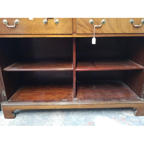 144 - A Georgian style mahogany bookcase with two upper astral glazed doors, two drawers and two lower cup... 