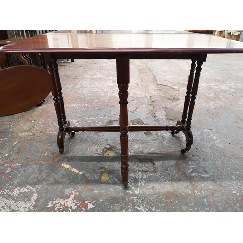 148 - An Edwardian mahogany drop leaf Sutherland table - approx. 72cm high x 91cm wide x 96cm long