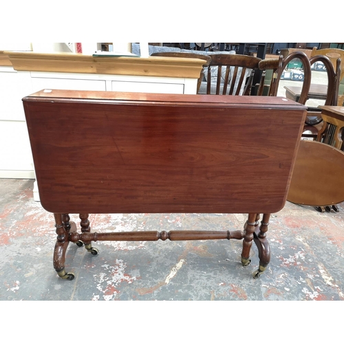 148 - An Edwardian mahogany drop leaf Sutherland table - approx. 72cm high x 91cm wide x 96cm long