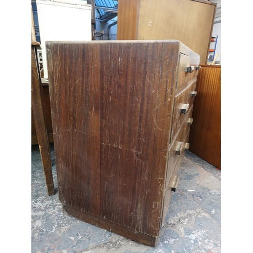 154 - A mid 20th century walnut chest of four drawers