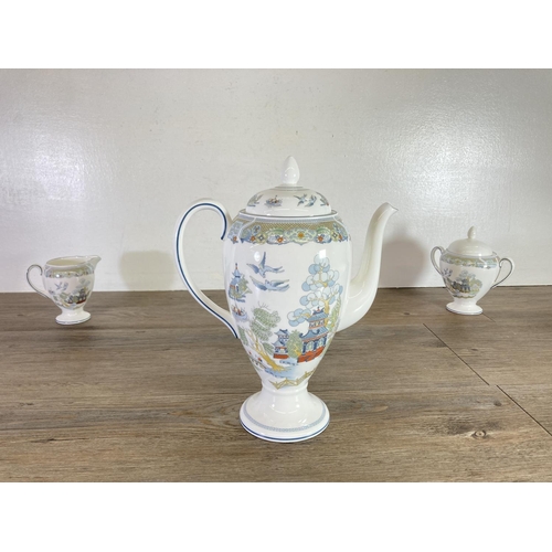 396 - Four pieces of Wedgwood Chinese Legend bone china, coffee pot, milk jug, sugar bowl and serving plat... 