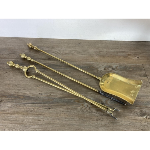 428 - A Victorian brass samovar - approx. 44cm high and brass three piece companion set