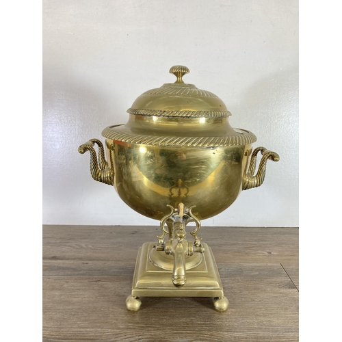 428 - A Victorian brass samovar - approx. 44cm high and brass three piece companion set