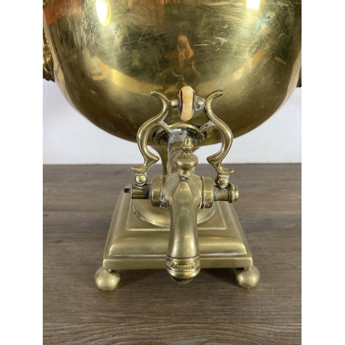 428 - A Victorian brass samovar - approx. 44cm high and brass three piece companion set