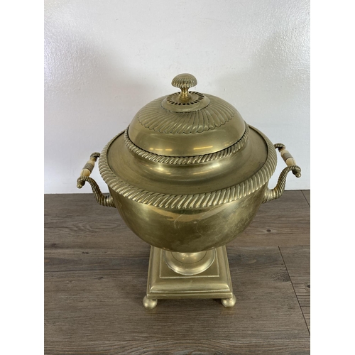 428 - A Victorian brass samovar - approx. 44cm high and brass three piece companion set