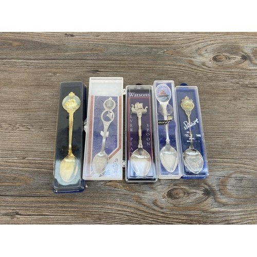 433 - A collection of silver plated souvenir teaspoons and a boxed Walker & Hall hallmarked Sheffield silv... 