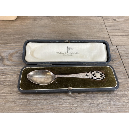 433 - A collection of silver plated souvenir teaspoons and a boxed Walker & Hall hallmarked Sheffield silv... 