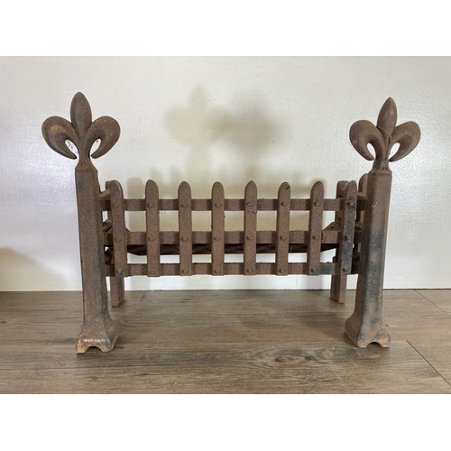 437 - A cast iron fire grate - approx. 38cm high x 53cm wide