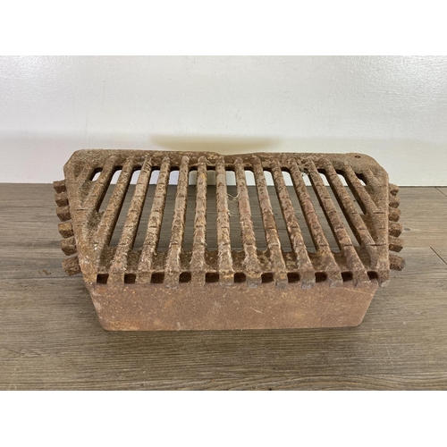 437 - A cast iron fire grate - approx. 38cm high x 53cm wide