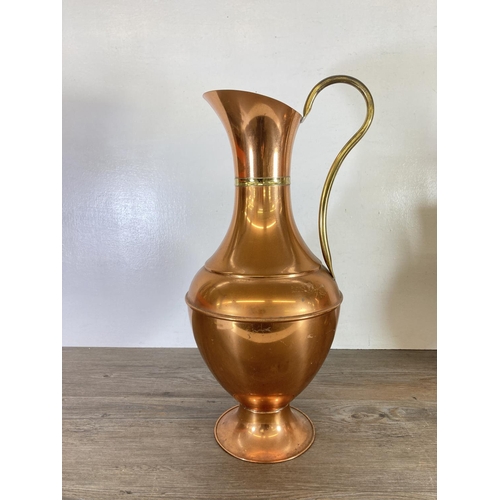 440 - Three copper and brass jugs - largest approx. 49cm high