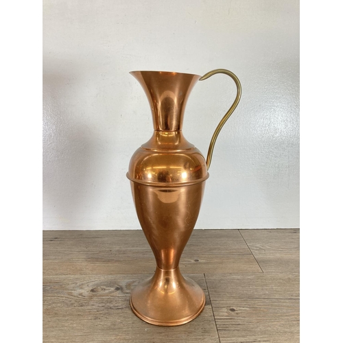 440 - Three copper and brass jugs - largest approx. 49cm high