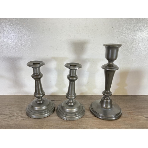 445 - A collection of pewter to include Tudric handled plate, candlesticks, tankards etc.