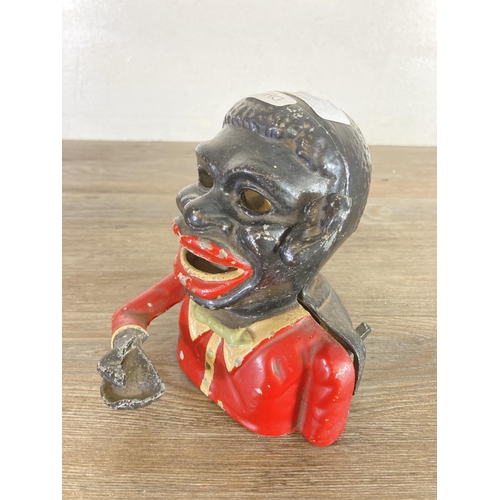 451 - A vintage cast metal novelty money box - approx. 16cm high