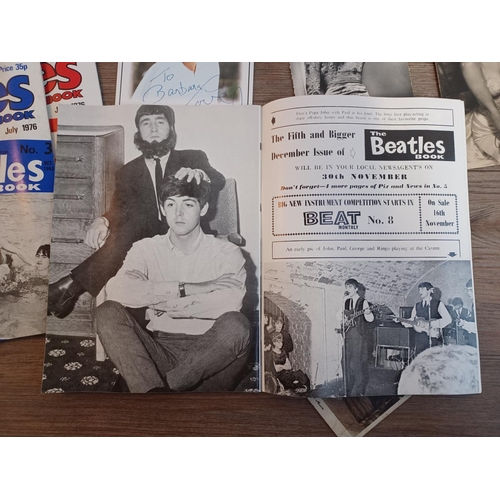 860 - A collection of items to include three 1976 The Beatles Appreciation Society magazines, signed Danie... 